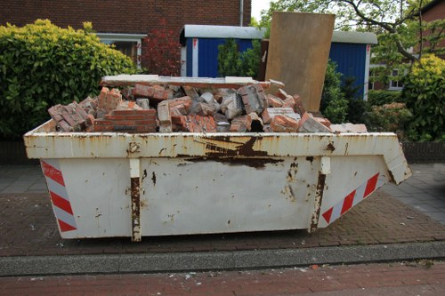 Exterior view of commercial waste collection vehicle near Cricklewood street